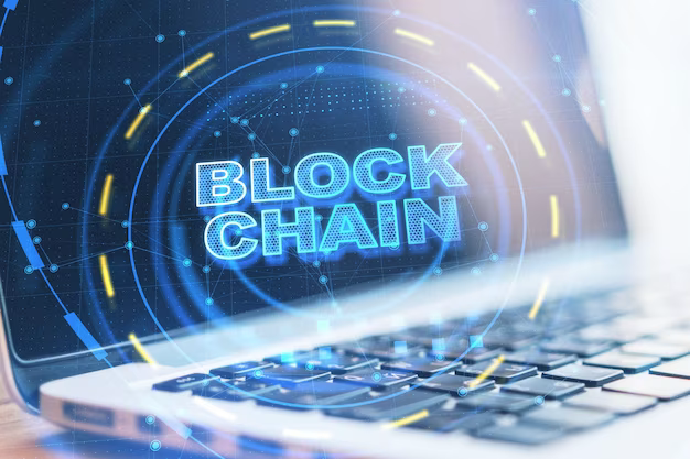 The word blockchain on a computer background